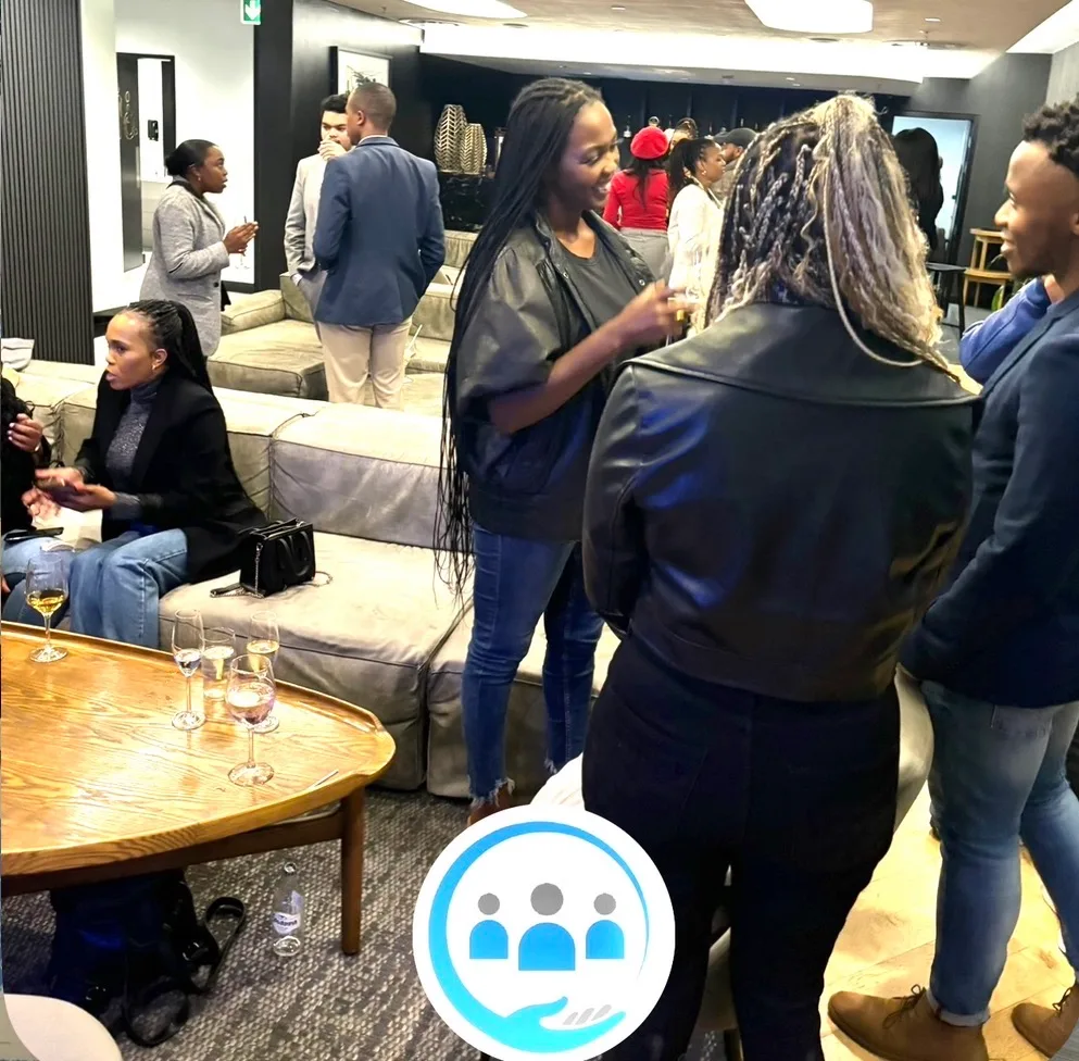 Professionals in conversation at the Them2Us networking event in Cape Town, South Africa, April 2024
